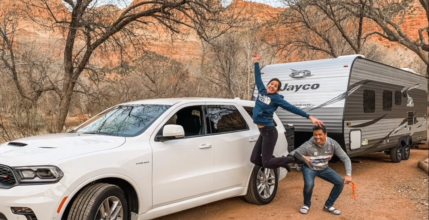 Business by Design has helped me live the life that I've been dreaming about for my family! (Yup! That's my husband and me at Zion National Park with our new RV!)